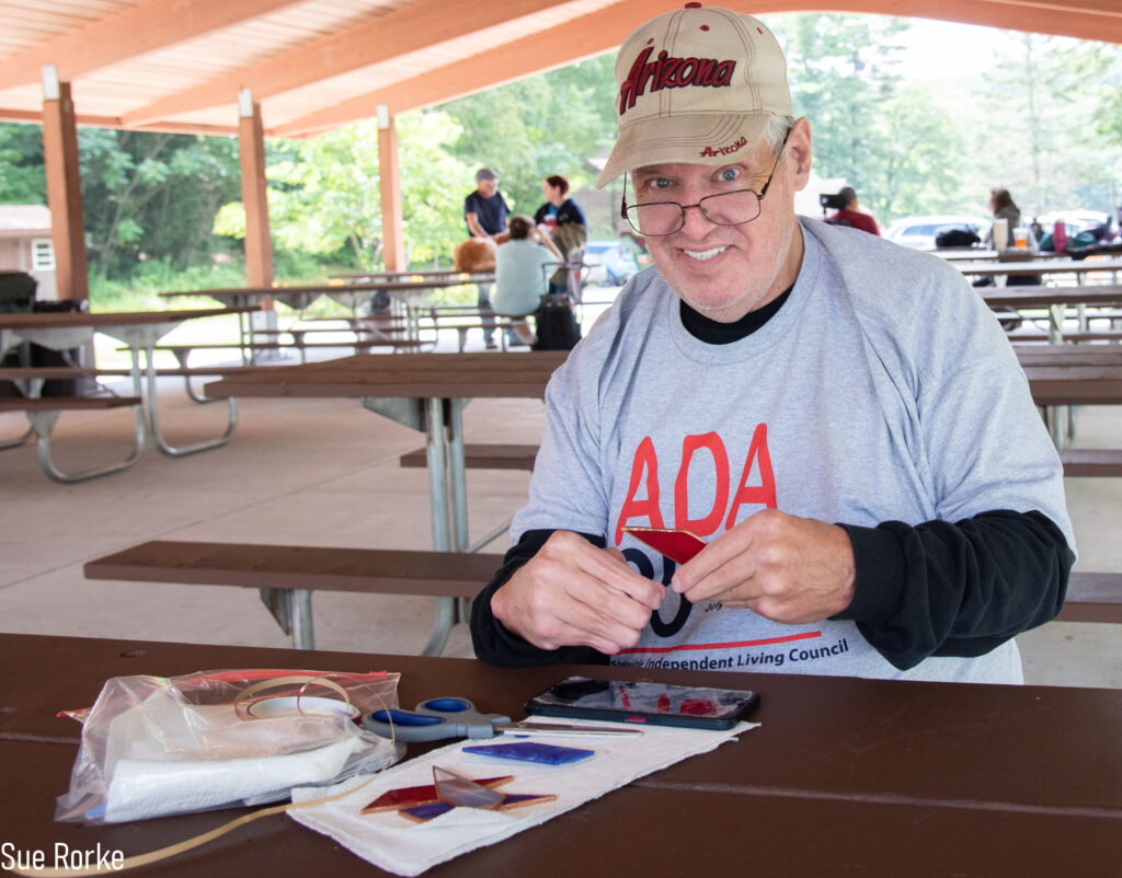 Jeff (MWCIL) working with stained glass