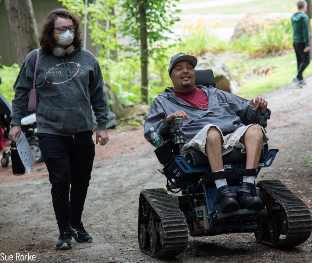 Man in trail chair with friend