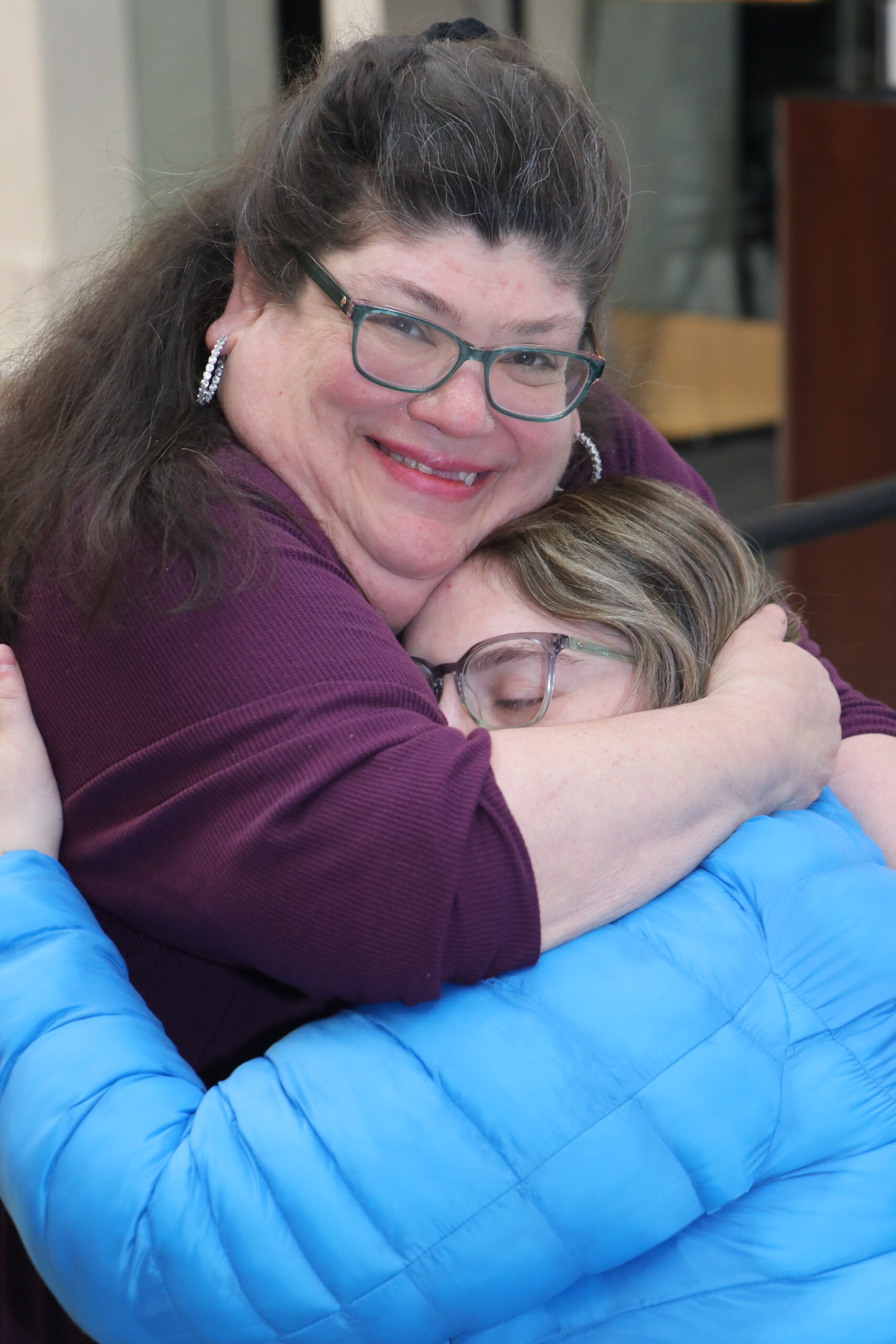 Two people hugging 