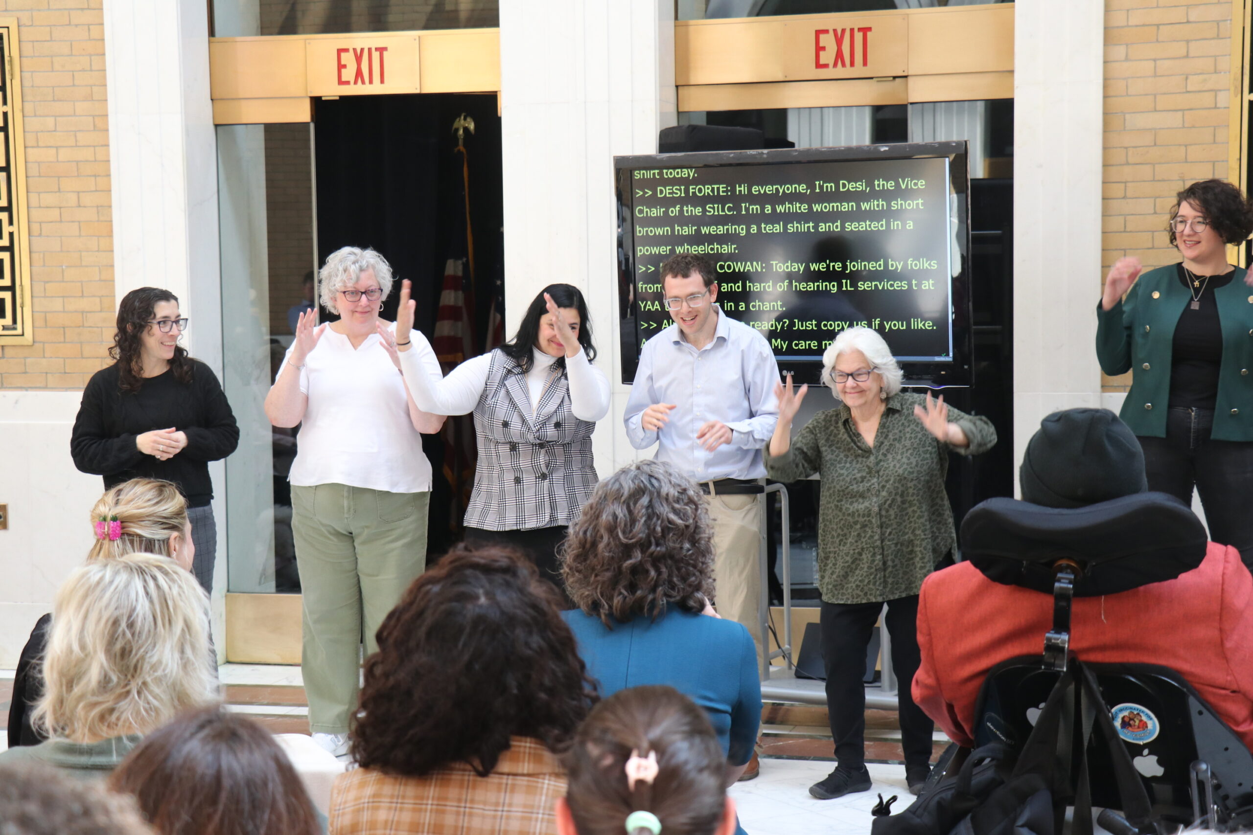 DHILS Program staff leading a chant in ASL