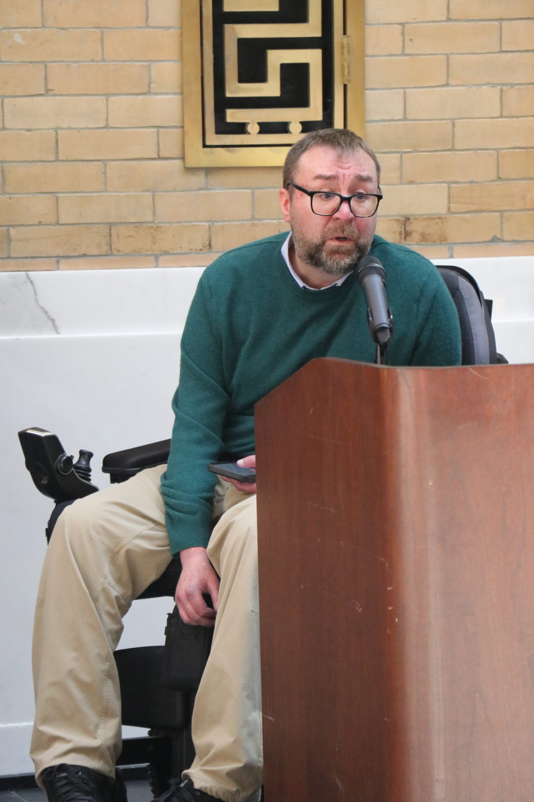 Councilor Rob Bilotta speaking at a podium 