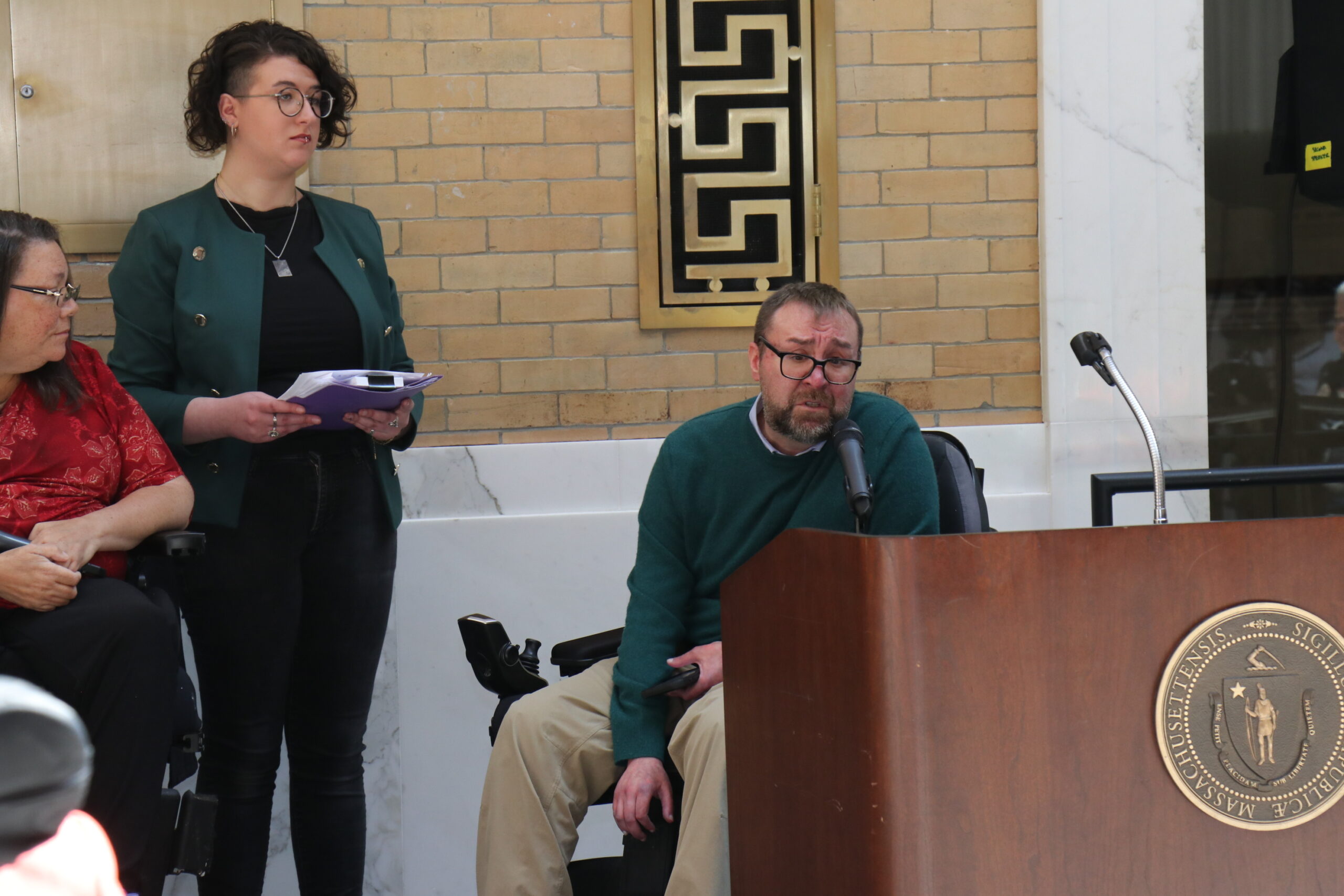 Councilor Rob Bilotta speaking at a podium
