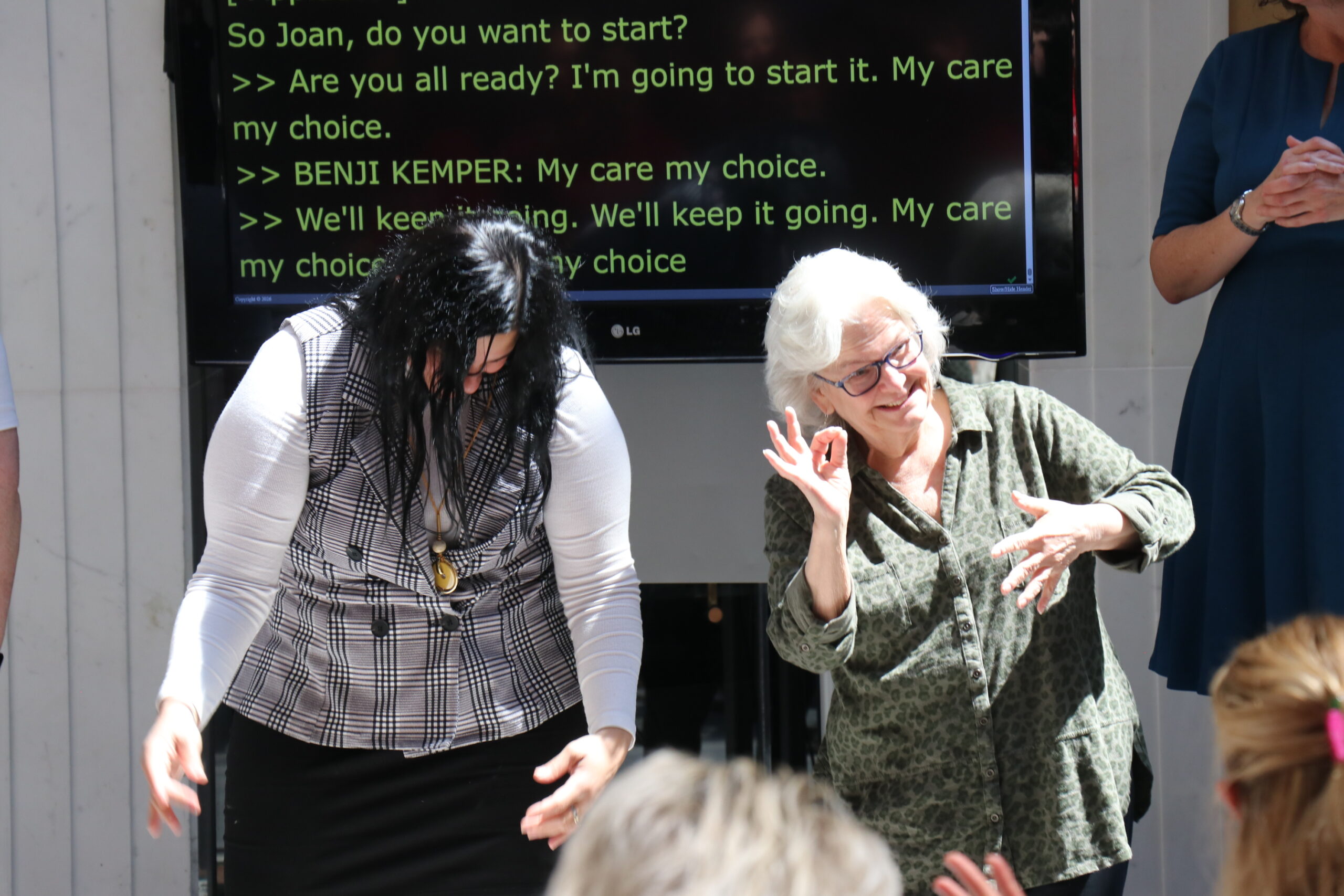 DHILS Program staff leading a chant in ASL