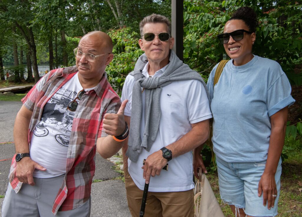 3 people posing and smiling