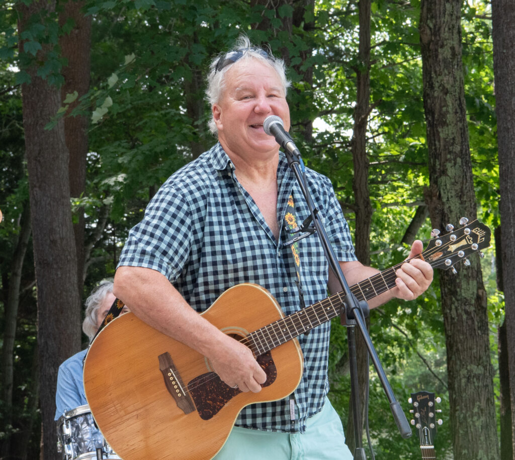 Tommy Filiault singing with the band