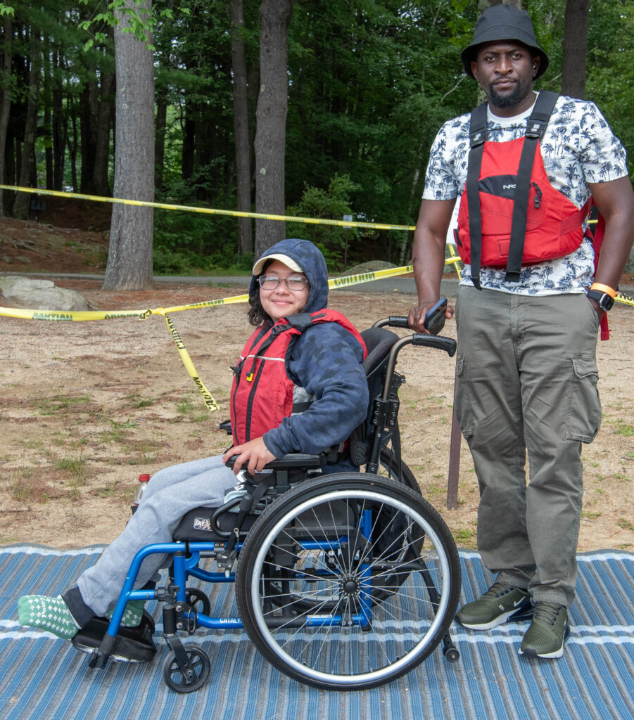 Two people getting ready to kayak