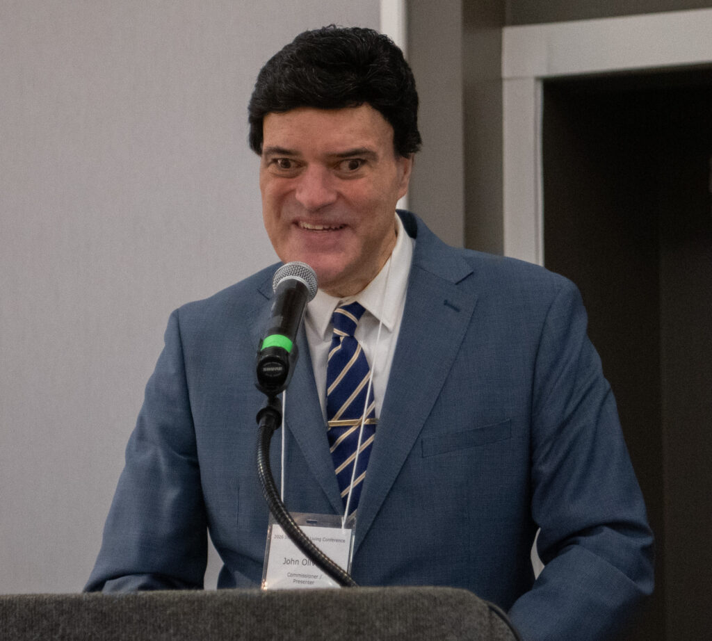 Commissioner John Oliveira, Massachusetts Commission for the Blind, speaking with microphone