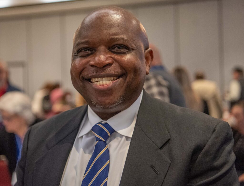 Commissioner Opeoluwa Sotonwa, Massachusetts Commission for the Deaf and Hard of Hearing, smiling