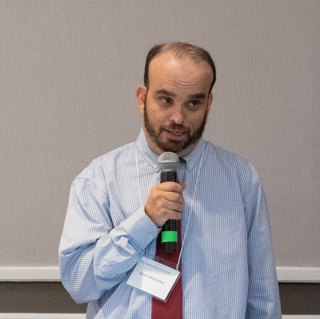 Allan Motenko, Executive Director of the Massachusetts Office on Disability, speaking with microphone