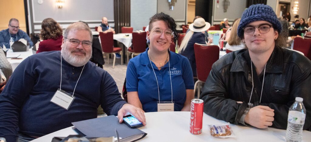 Three people smiling for a photo